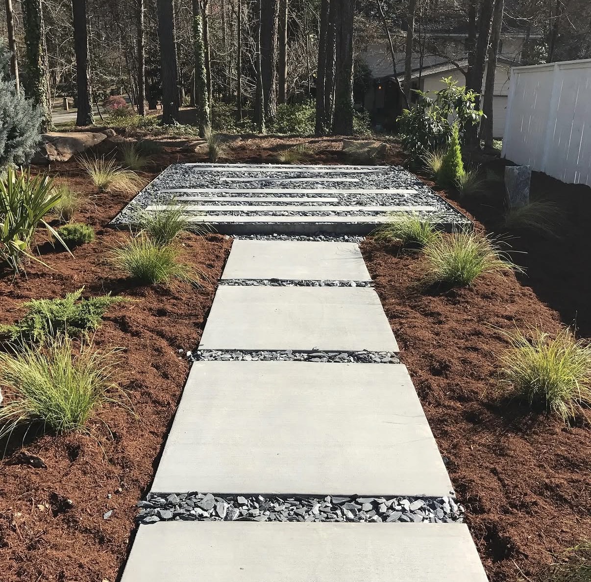 Finished slab walkway with slate gravel — Noels Concrete work